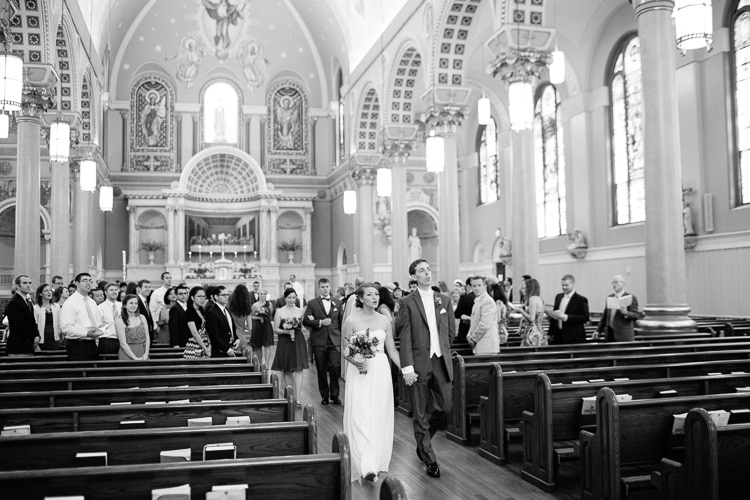 bride and groom sing during recessional following ceremony, St. Cecilia's Church, Boston
