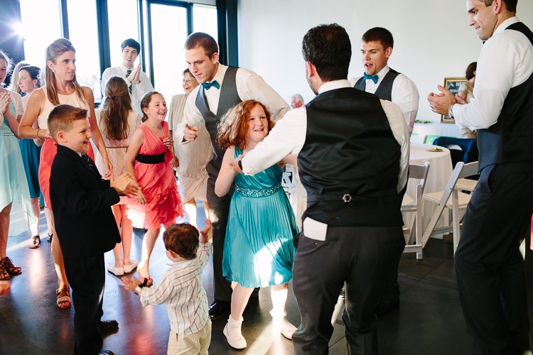 guests dance at wedding reception at Harry Parker Boathouse, Community Rowing
