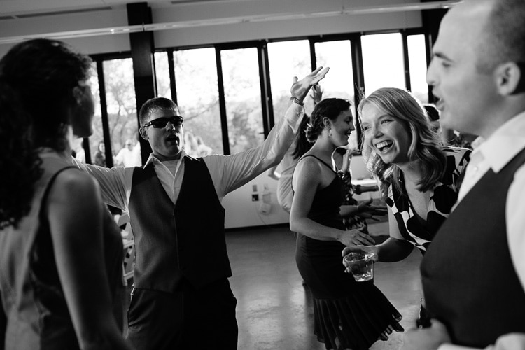 guests dance at wedding reception at Harry Parker Boathouse, Community Rowing