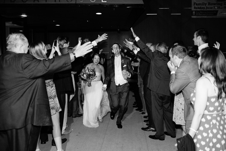 bride and groom exit reception at Harry Parker Boathouse