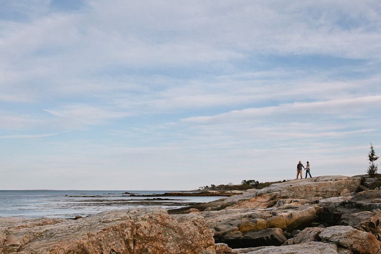 relaxed engagement session photograph with large landscape view of the New Hampshire seacoast