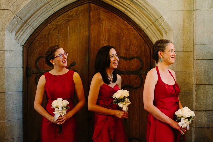bridesmaids look on during wedding ceremony