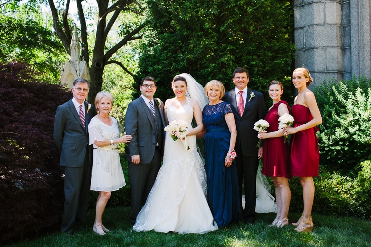 formal portrait of bride and groom with both families