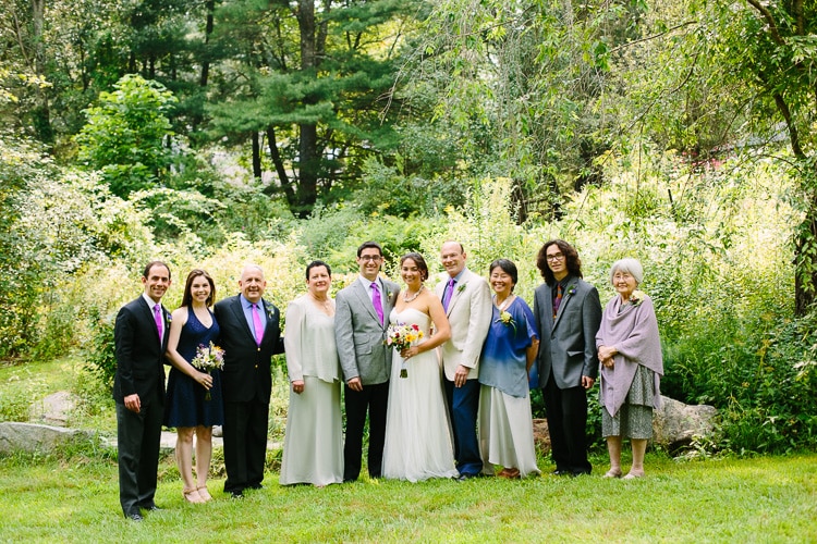 portrait of bride and groom with both their families