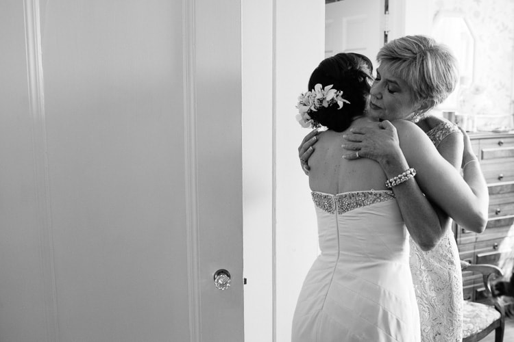 bride and mother embrace