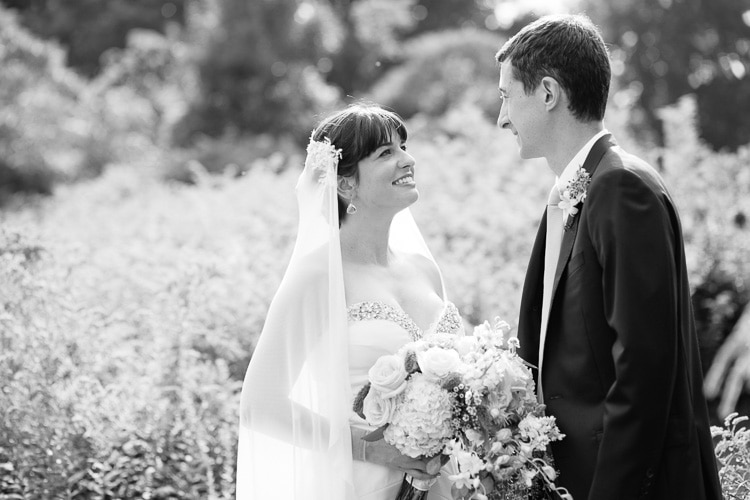 bride and groom share a smile
