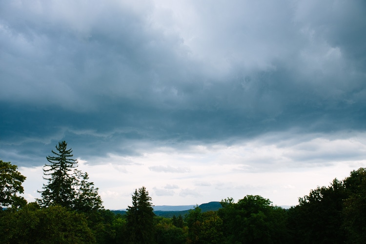storm clouds threaten outdoor wedding
