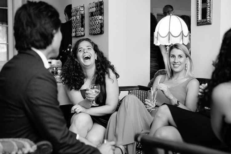 guests laugh during cocktail hour in the lobby of the Apple Tree Inn, Lenox, MA