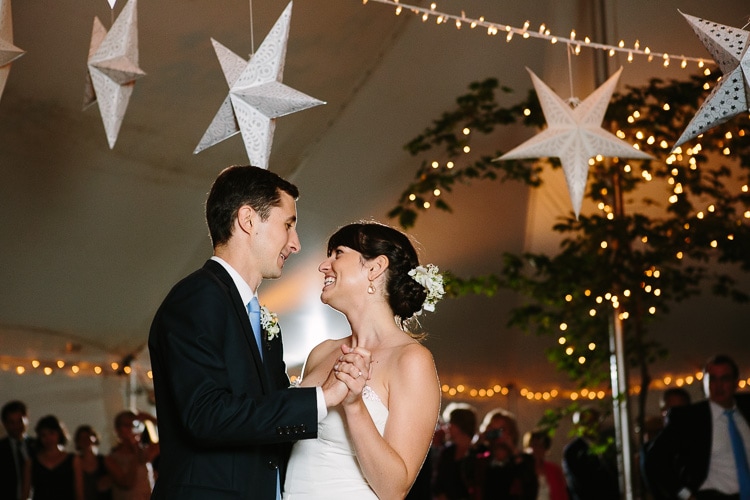 bride and groom share dance under stars and twinkle lights