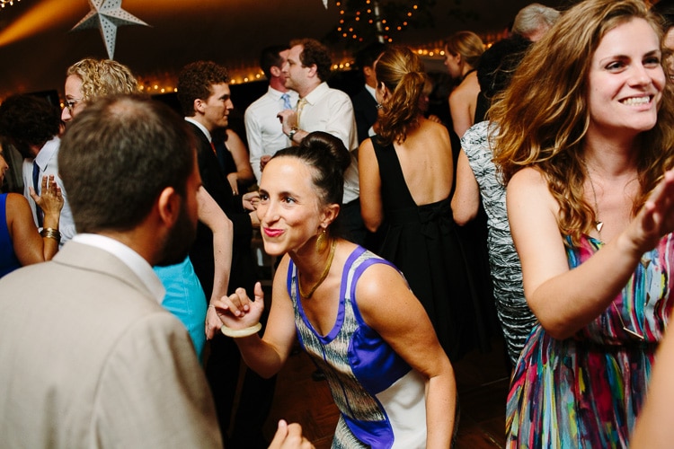 candid photo of guests dancing during wedding reception