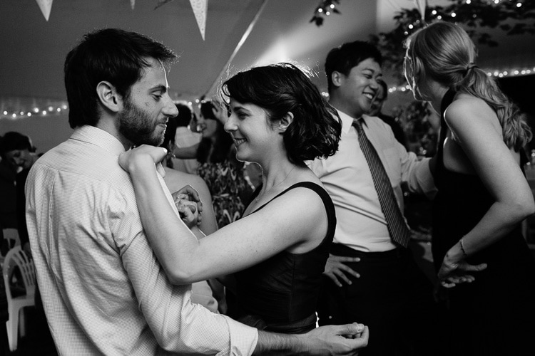 candid photo of guests dancing during wedding reception