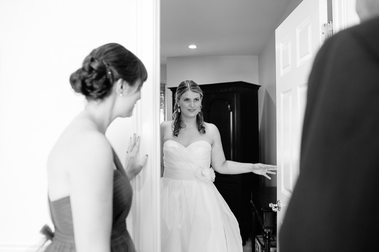 bride shows her dress to family