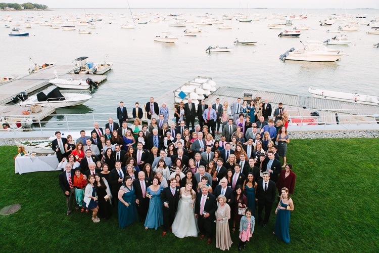 group photo of all wedding guests during cocktail hour at the Duxbury Bay Maritime School