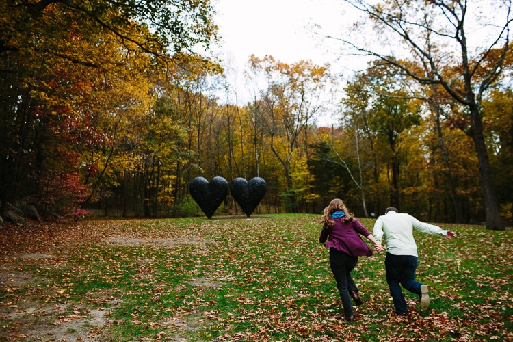 running towards the two hearts sculpture at the deCordova Sculpture Park