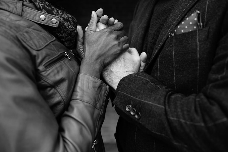 holding hands during a Cambridge engagement session