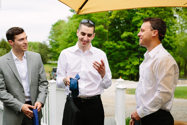 Groom and groomsmen getting ready outside at the Friendly Crossways Retreat Center