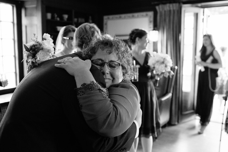 hugs after the wedding ceremony at Willowdale Estate, photo by Kelly Benvenuto