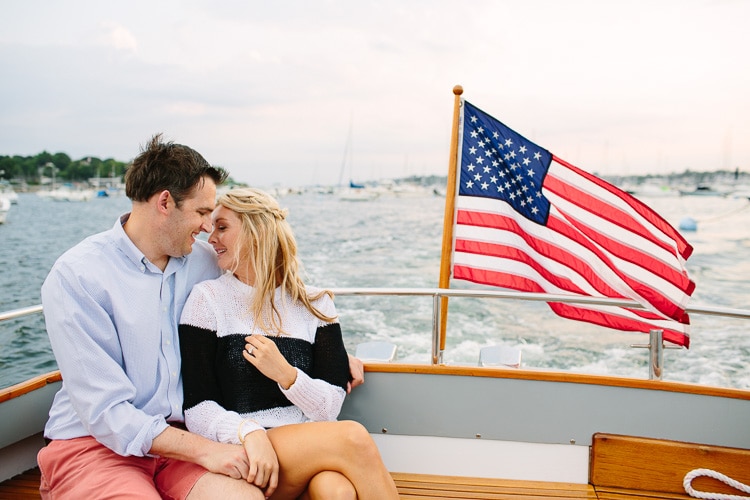 engagement photos on boat in Marblehead harbor, photo by Kelly Benvenuto