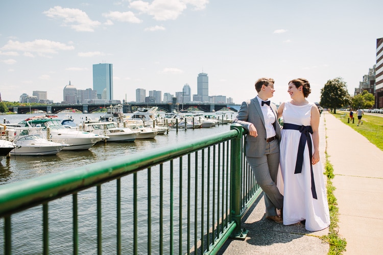 wedding portrait along the Charles River with Boston view