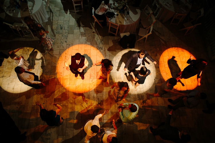 guests dance in the spotlights at the Cambridge Multicultural Arts Center wedding