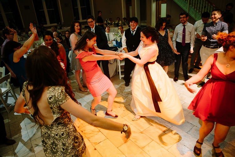 bride dances with guest during Cambridge Multicultural Arts Center wedding reception