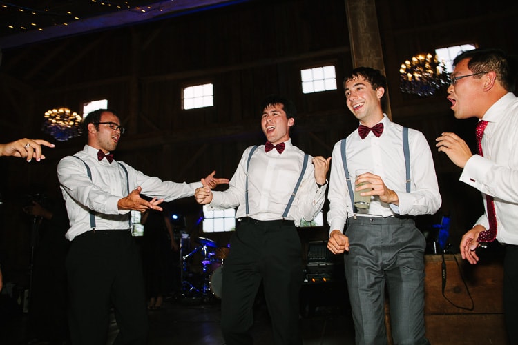 groomsmen let loose on dance floor