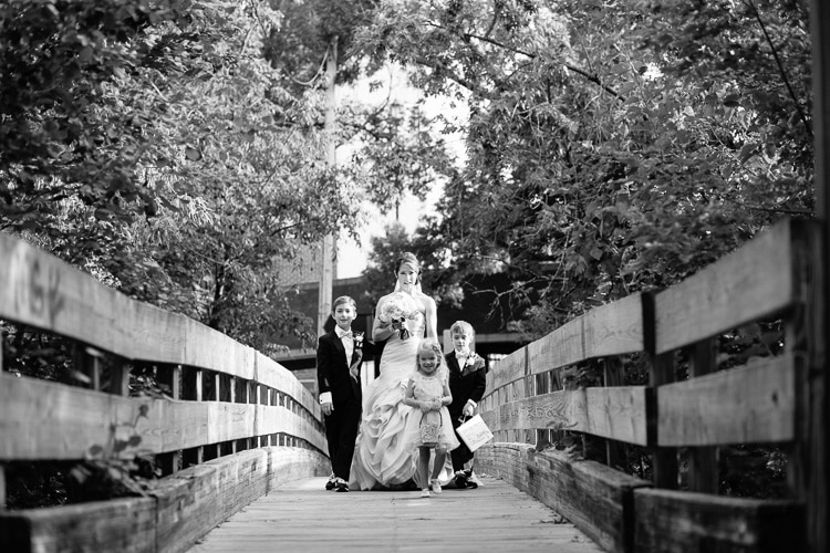 bride waits to make her entrance with her sons and flower girl