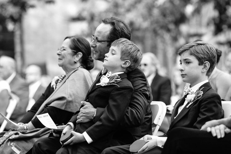 brides' sons, brother and mother watch wedding ceremony