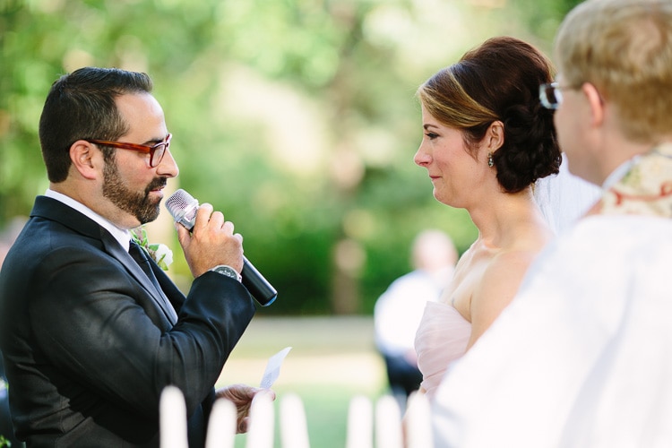 bride and groom speak their vows, outdoor interfaith wedding ceremony, Charles River Museum wedding