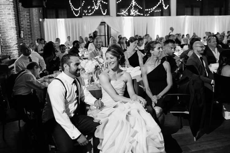bride and groom react to toast, Charles River Museum wedding photography