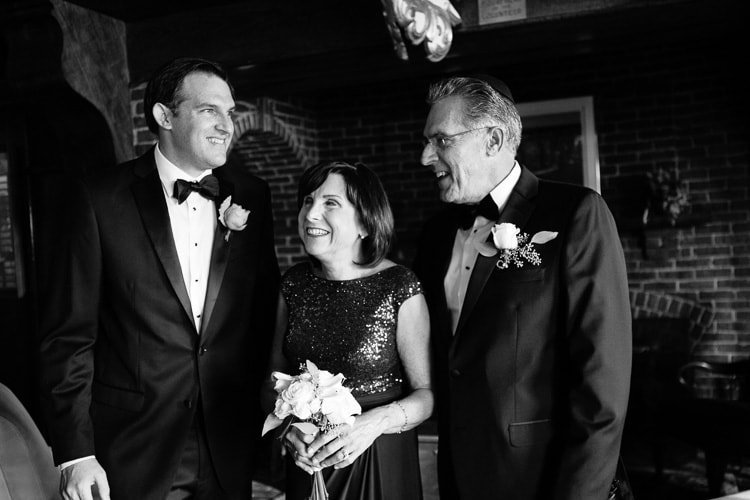 groom with parents before wedding ceremony at the Corinthian Yacht Club