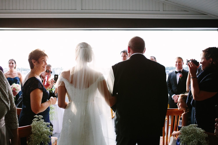 The wedding ceremony of Melissa and David at the Corinthian Yacht Club in Marblehead, MA.