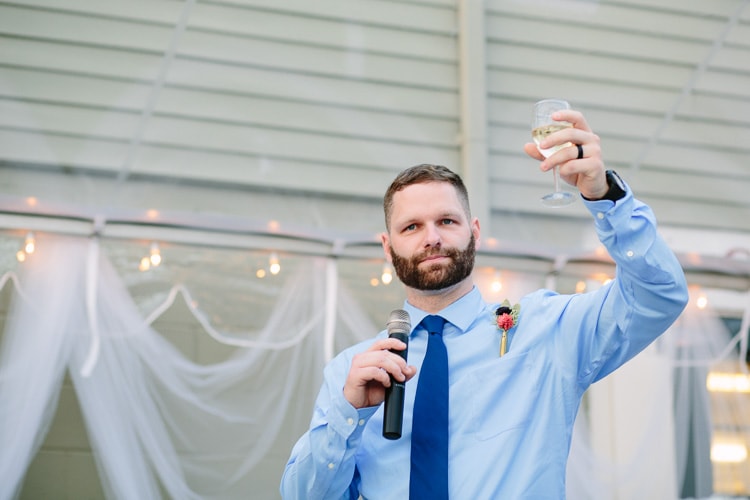 best man raises a glass