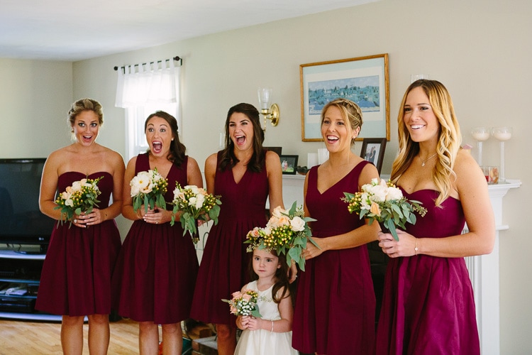 bridesmaids react to seeing bride in her wedding dress