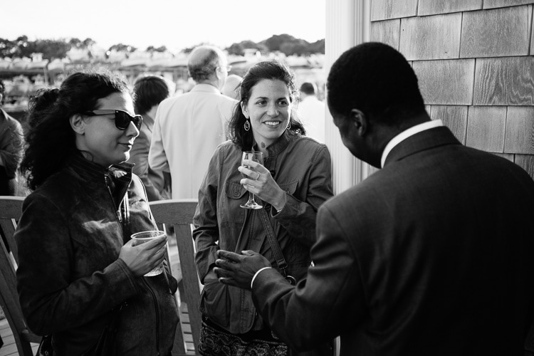 wedding guests enjoy cocktail hour at the Duxbury Bay Maritime School
