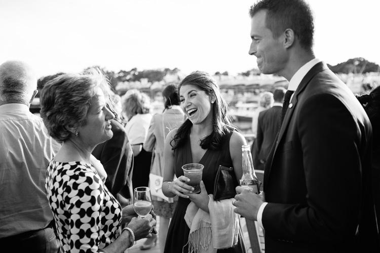wedding guests enjoy cocktail hour at the Duxbury Bay Maritime School