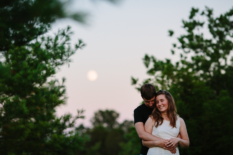 sweet engagement photo with full moon
