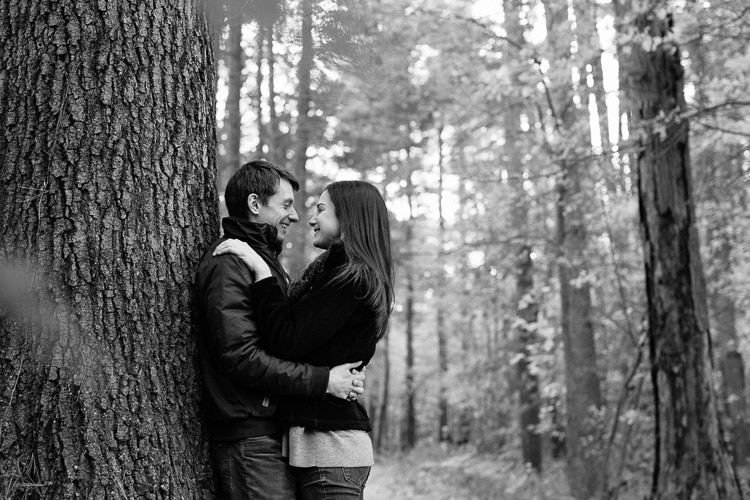 Engagement photos in woods at the Middlesex Fells, north of Boston, MA. Photo by Kelly Benvenuto.