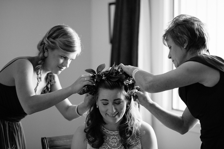 bride being crowned with floral wreath, photo by Boston wedding photographer Kelly Benvenuto