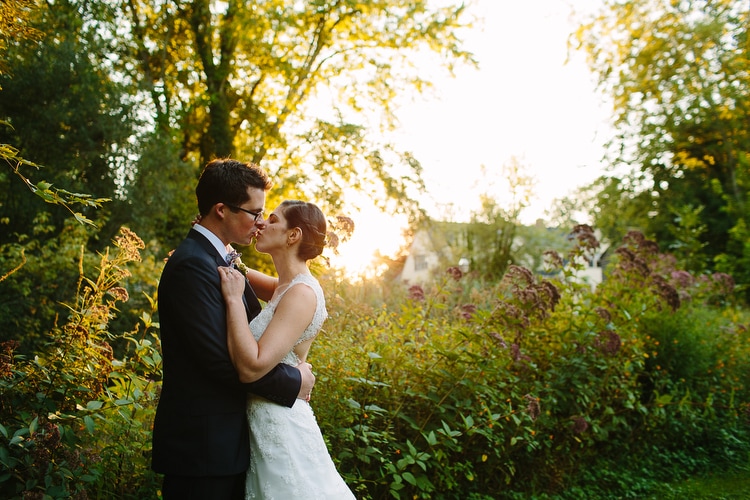 Romantic, golden hour wedding portrait on the grounds of the Meeting House in Tiverton, RI. Intimate Rhode Island wedding photography by Kelly Benvenuto.