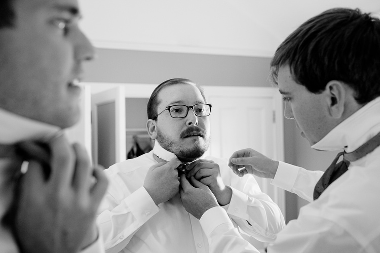 Groom getting ready at the Willowdale Estate. Honest documentary wedding photography in New England by Kelly Benvenuto.