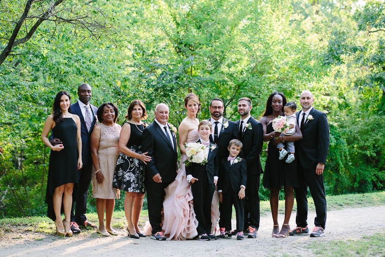 Family portrait taken at a Charles River Museum of Industry and Innovation wedding in Waltham, MA. Classic and colorful wedding photography by Kelly Benvenuto.