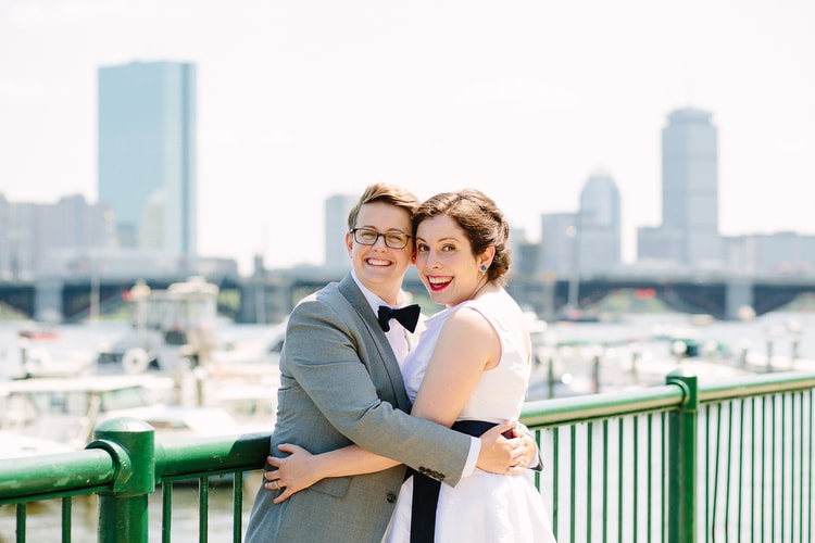 Wedding portrait along the Charles with Boston skyline. Relaxed and vibrant wedding photography by Boston wedding photographer Kelly Benvenuto.
