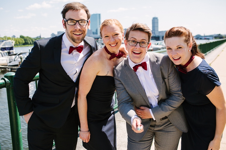 Wedding party channels Dr. Who for this portrait along the Charles River, in Cambridge, MA. Vibrant, authentic wedding photography by Kelly Benvenuto.