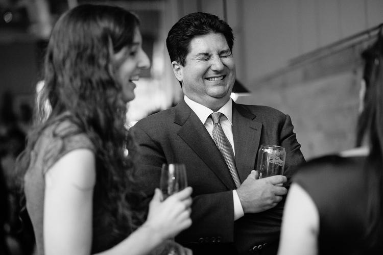 Wedding guests enjoy cocktail hour. Image by Kelly Benvenuto.