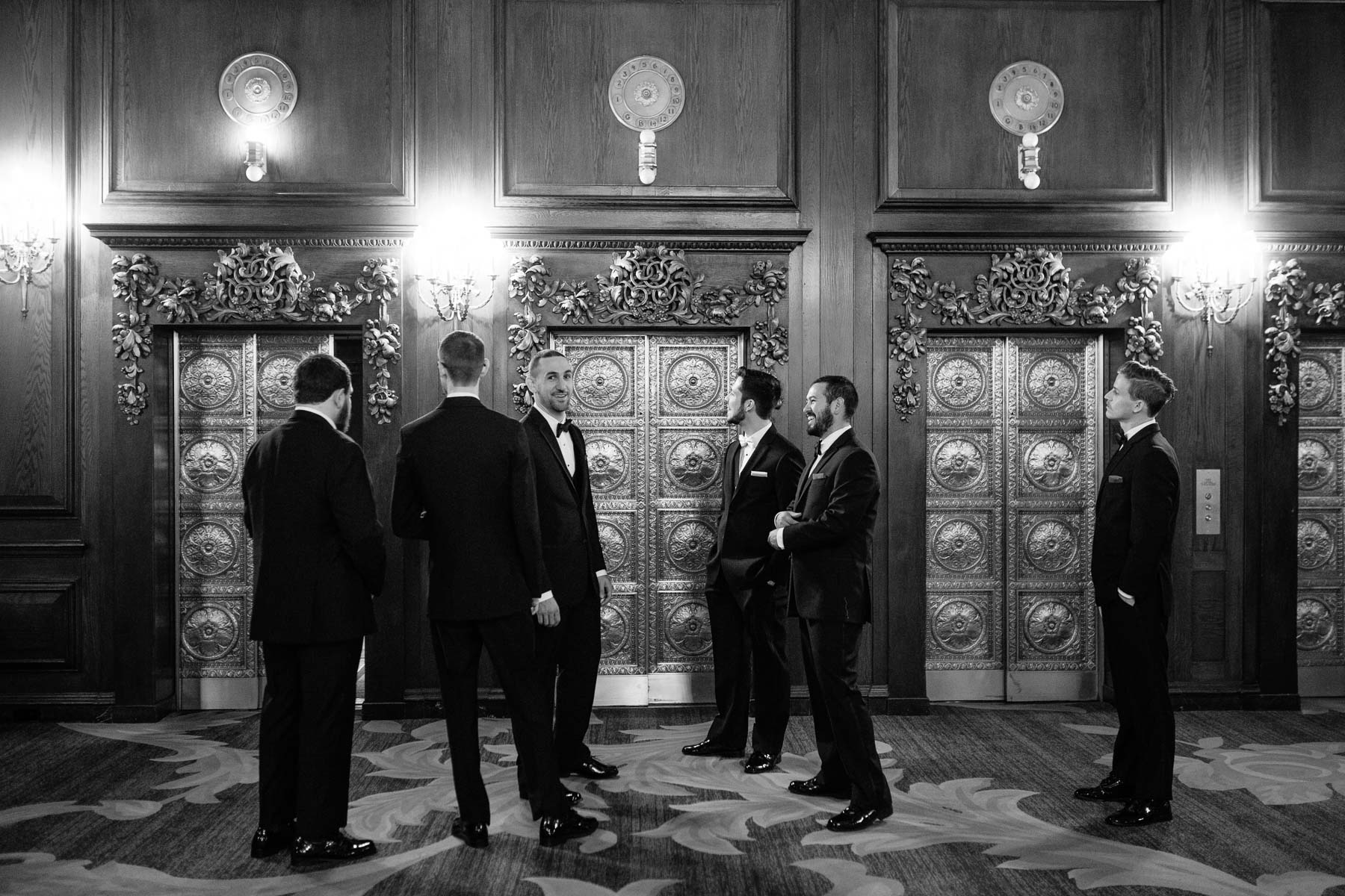 groom and groomsmen in the lobby of the groom getting ready at the Omni Parker House