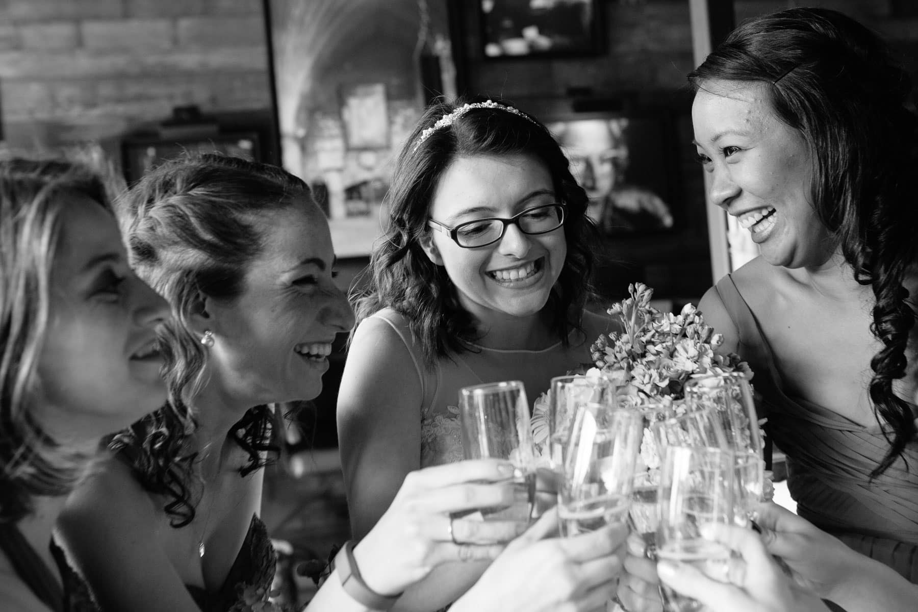bride shares a toast with her bridesmaids at Barcelona Wine Bar wedding