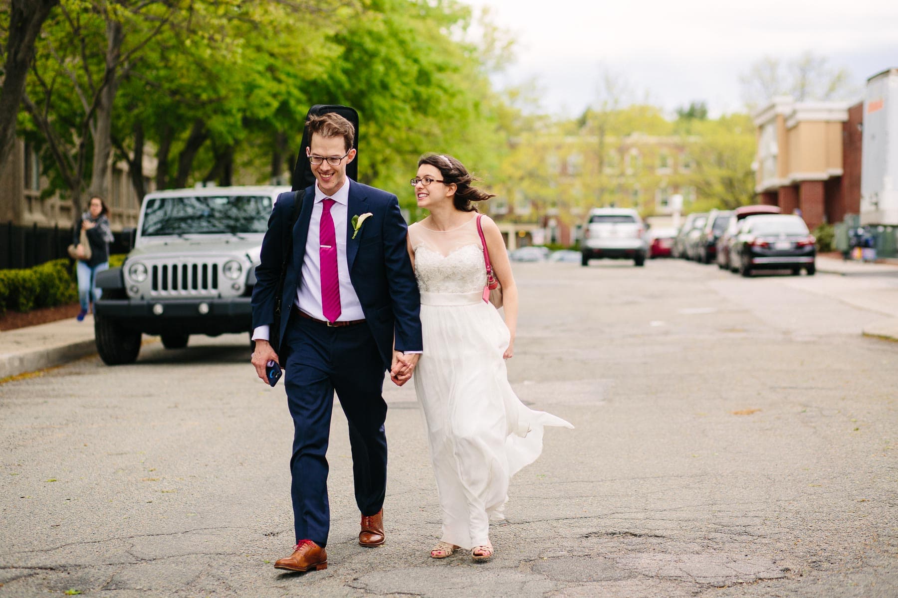 bride and groom walk streets of Brookline
