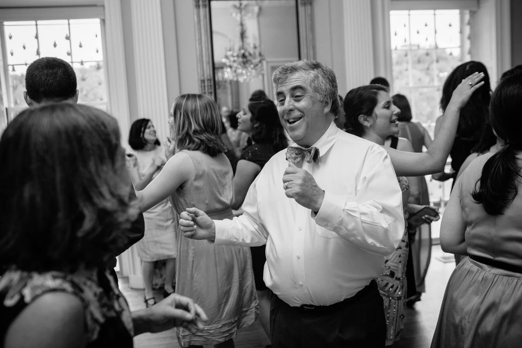 guests dance in the ballroom of the Lyman Estate