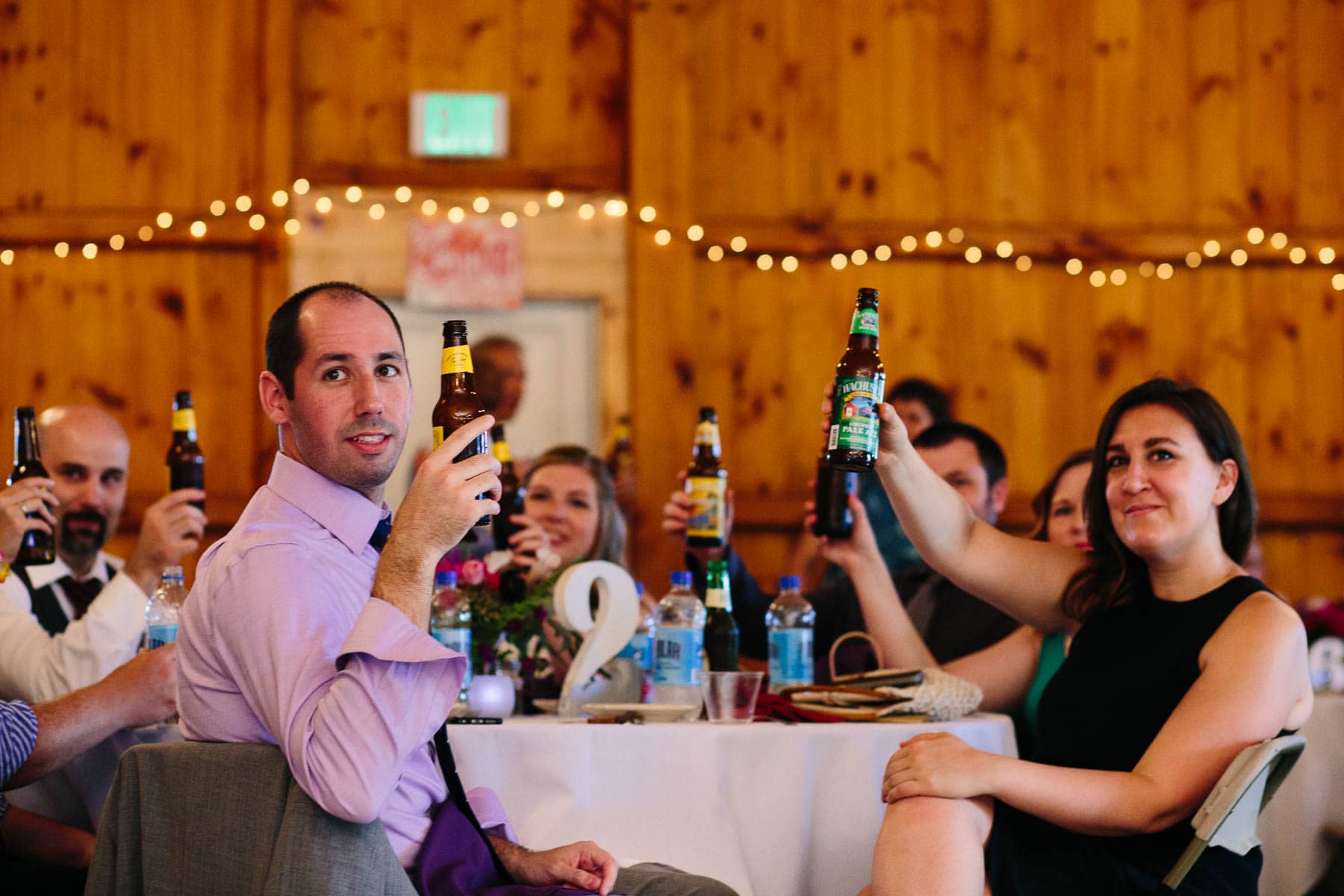 wedding toast in the barn at Red Apple Farm, Phillipston, MA